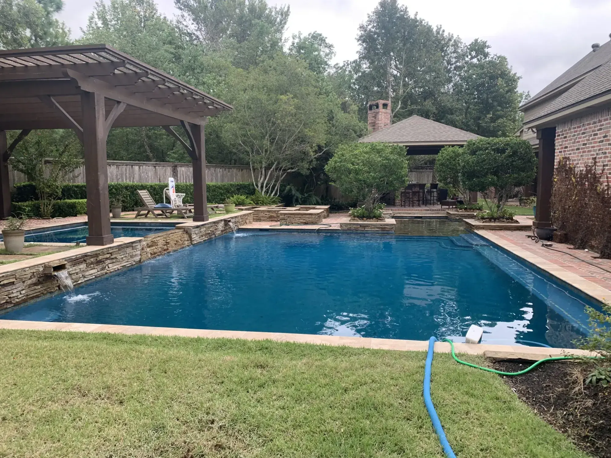 Rectangular pool with cedar pavilion and landscaped surround